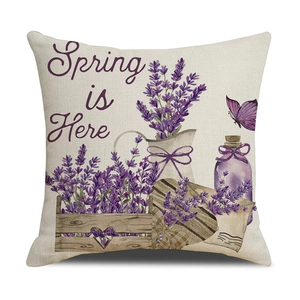 Detail of linen pillowcase with lavender flowers, butterfly, and Spring is Here text