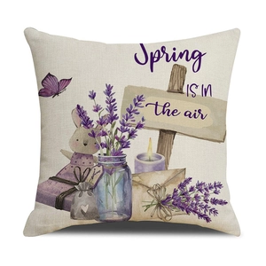 Close-up of linen pillowcase with lavender motifs and Spring IS IN the air text