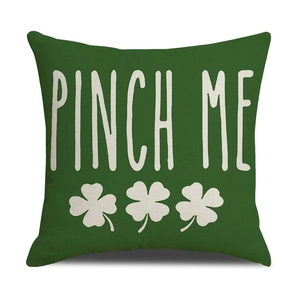 Detail of dark green linen St. Patrick's Day pillowcase with white Pinch Me text