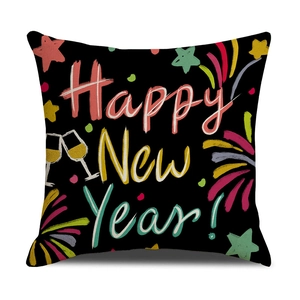 Close-up of black Happy New Year throw pillow cover with festive champagne and stars