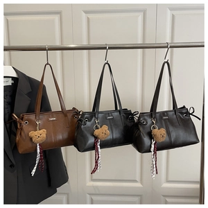 Detailed close-up of retro oil wax leather tote bags in brown, black, and dark coffee
