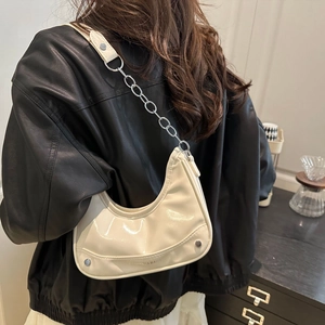 Minimalist creamy white leather hobo bag with silver chain and metal stud details