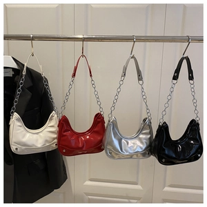 Detailed display of fashionable hobo bags in white, red, silver and black with chain straps