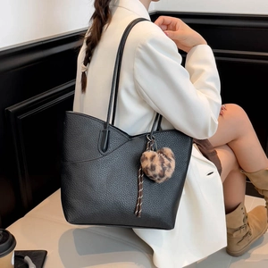 Minimalist black lychee leather tote bag for women with leopard print charm detail