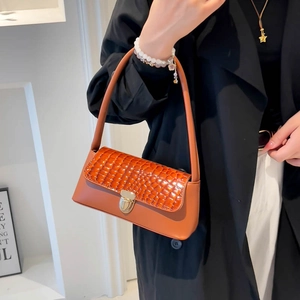 Brown faux leather baguette shoulder bag with crocodile pattern flap and gold clasp