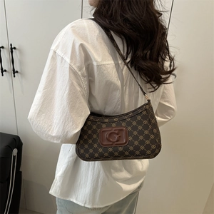 Retro brown monogram hobo shoulder bag with crossbody strap and gold metal hardware