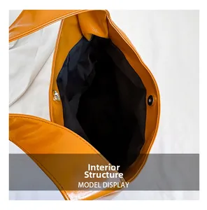 Detail showing ginger yellow tote bag internal structure with magnetic clasp and black lining