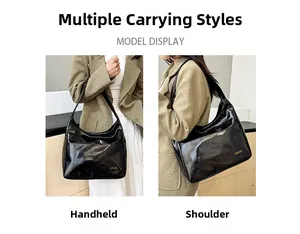 Detail showing various carrying styles of the black glossy faux leather tote bag