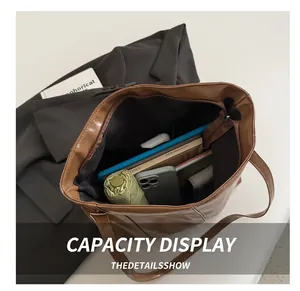 Top view of brown PU leather tote bag showing large capacity for laptop and essentials