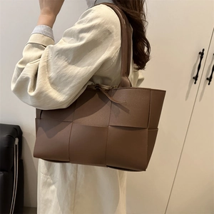 Deep brown oversized woven tote bag in high-quality faux leather for casual daily commute