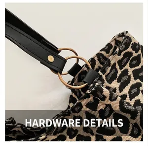 Detail showing leopard print fabric texture and golden rings with black leather strap