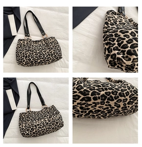 Detail view of leopard print tote bag with thick canvas texture and metal ring straps