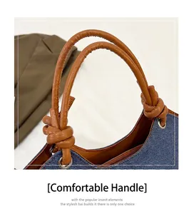 Détail du sac en jean avec poignée nouée en similicuir marron et fermeture éclair solide