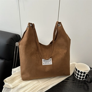 Minimalist brown faux suede tote bag with stylish graphic label and large capacity