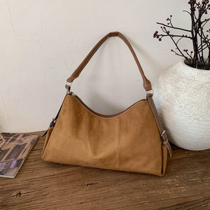 Vintage brown suede hobo bag with white stitching and shoulder strap for women