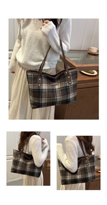Detail of vintage plaid tote bag featuring brown leather trim and golden metal rivets