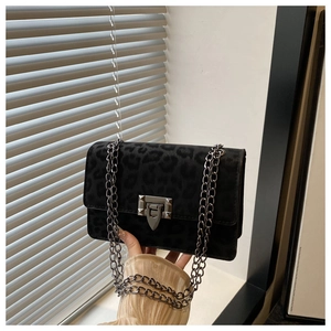 Elegant dark leopard print crossbody bag with silver chain strap and vintage metal lock