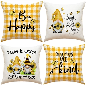Detail view of 4-piece bee and gnome print decorative linen throw pillow covers
