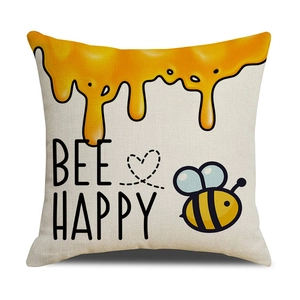 Dettaglio della federa in lino con stampa Bee Happy e illustrazione di api e miele