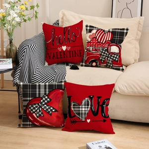 Valentine's Day linen pillowcase set with red heart and truck prints on a beige sofa