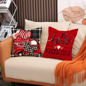 Valentine's Day throw pillow covers with heart designs and vintage truck on sofa