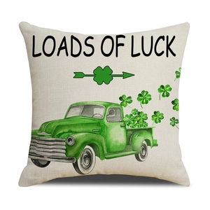 Close-up of St. Patrick's Day cushion cover with vintage truck and lucky clover design