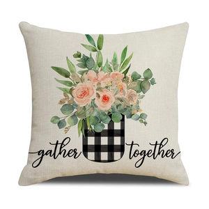 Detail of linen pillowcase featuring watercolor pink roses and 'gather together' text