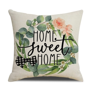 Linen pillow cover with floral wreath and HOME sweet HOME lettering on white background