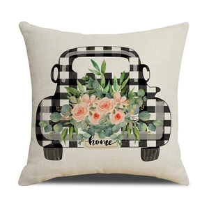 Detailed texture of linen pillowcase with floral truck print and home lettering