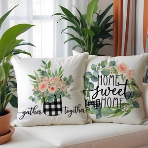 Set of 2 linen pillow covers with floral patterns and Home Sweet Home text on sofa
