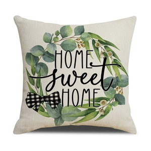 Detailed texture of linen cushion cover featuring green wreath and HOME sweet HOME print