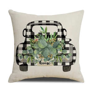 Detailed texture of square linen pillowcase with green eucalyptus and truck print