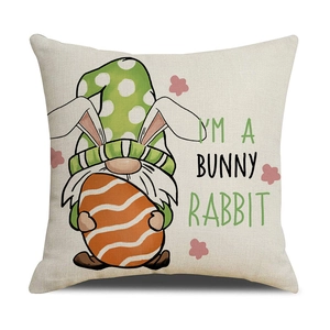 Detail of linen Easter pillow cover featuring a cute gnome and bunny rabbit design