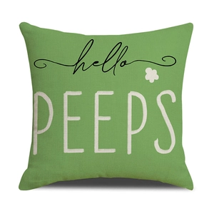 Detail of green Easter linen pillowcase featuring hello PEEPS text and floral pattern