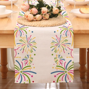 Linen texture detail of a Happy New Year table runner with colorful fireworks patterns