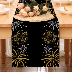 Detail of Happy New Year table runner with gold and silver fireworks on black linen