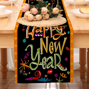 Close-up of Happy New Year linen table runner with gold stars on a wooden dining table