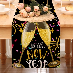 Detail of linen table runner with Happy New Year print on a wooden dining table
