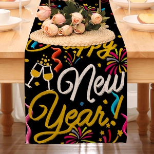 Linen New Year table runner with Happy New Year text and fireworks on wood table