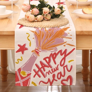 Detailed New Year table runner featuring champagne print and Happy New Year text