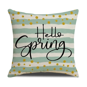 Detail of Hello Spring throw pillow cover with mint stripes and gold polka dots texture