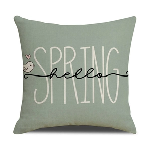 Detail of sage green Easter pillow cover showing cotton linen texture and hello SPRING print