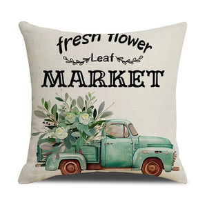 Détail de la housse de coussin en lin avec camion vert vintage et imprimé floral