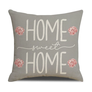 Détail d'une taie d'oreiller en lin avec imprimé pivoine et texte Home Sweet Home