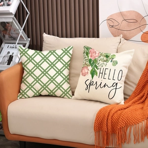 Floral and green plaid linen cushion covers set on sofa with spring flower print