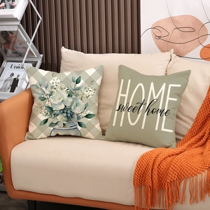 Set of two decorative square pillows with floral patterns and Home Sweet Home text