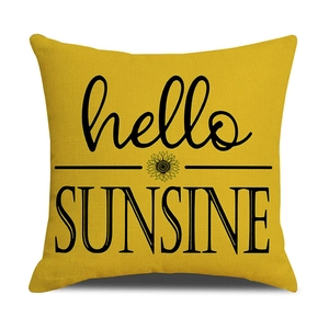 Macro shot of yellow linen pillowcase showing fabric texture and hello SUNSINE print