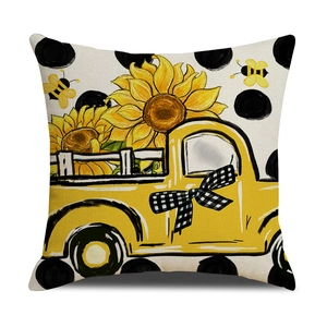 Floral throw pillow cover with sunflower truck print and polka dots on white background
