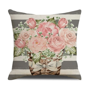 Detail of linen sunflower pillowcase featuring watercolor pink roses in a woven basket