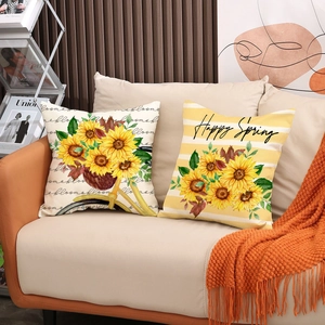 Détail de coussins tournesol en lin avec vélo vintage et texte Happy Spring décoratif